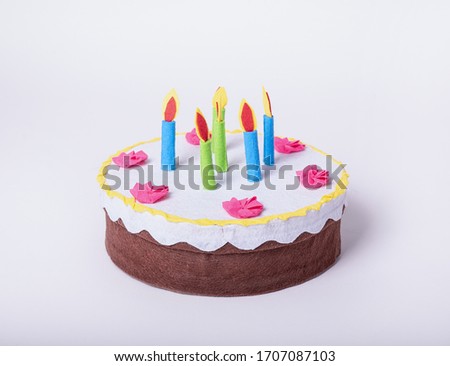 Artificial cake on a white isolated background
