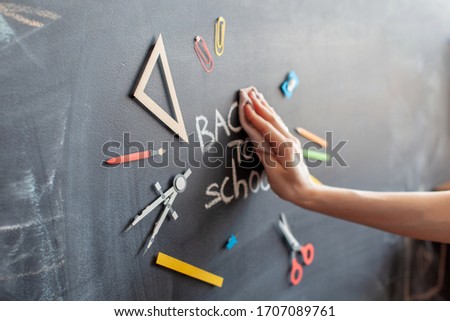 Back to school. Tools for education on chalkboard background. Banner. Hand write with chalk. Blurred image. 