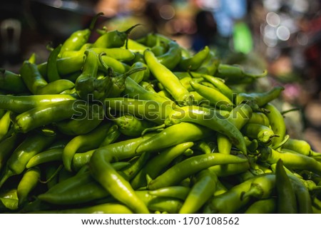 Hungarian wax pepper and Banana Pepper chili for sale on market background. selling green bajji chilli and mirchi bajji on market. Stock photo on