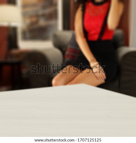 Table background of free space and home interior with woman body 