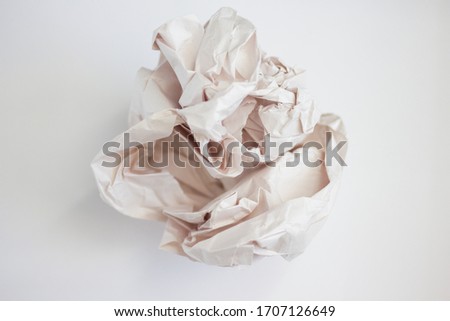 crumpled sheet of paper on a white background