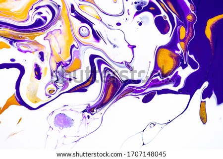 Fluid art texture. Backdrop with abstract swirling paint effect. Liquid acrylic picture with artistic mixed paints. Can be used for baner or wallpaper. Purple, white and golden overflowing colors