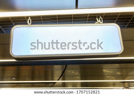 Empty light board suspended from the ceiling. Space for text. Background. 