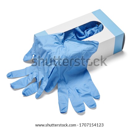 close up of a box of white latex protective gloves on white background Royalty-Free Stock Photo #1707154123