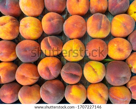 fresh ripe peaches lined up on the table. top view. fruit background