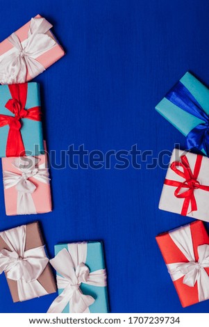 lots of gifts for a birthday party on a blue background