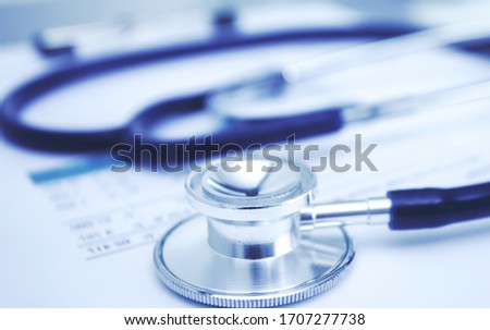 Medical equipment: blue stethoscope and tablet on white background. Medical equipment Royalty-Free Stock Photo #1707277738