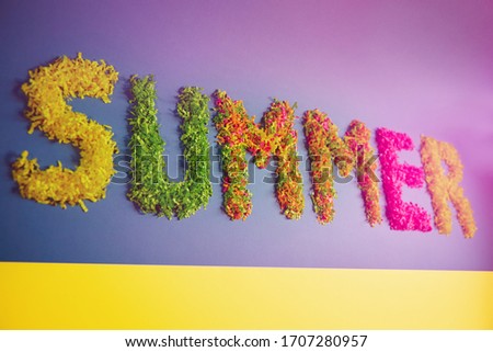 Bright lettering summer from paper grass. Summer colorful letters of the banner on the paper