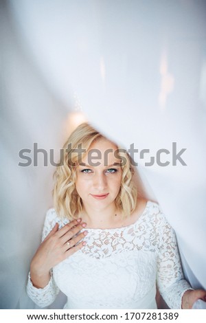 portrait of blonde bride in a wedding dress

