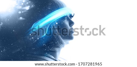 Beautiful woman in futuristic costume over white background. Girl in 3d glasses of virtual reality. Augmented reality, game, future technology, AI concept. VR. Blue neon light.