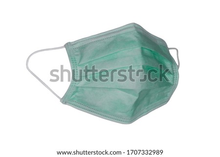 Green mask for medical use, white background, mask for wear to prevent germs