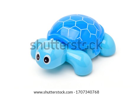 Front view of Blue plastic turtle toy isolated on white background. Clipping path.