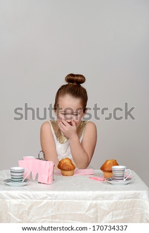 little girl giggling at tea party