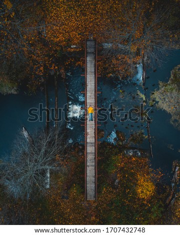Autumn bridge over the river, Belarus