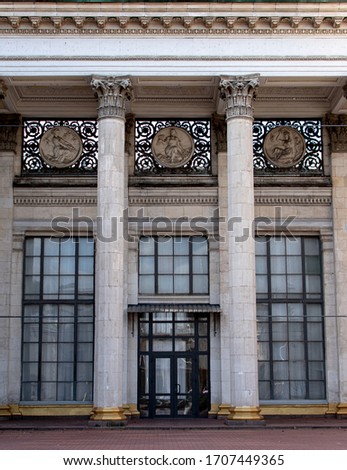 A building with columns and large glass windows as texture