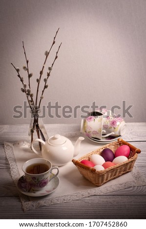 Easter composition with painted eggs and willow branches