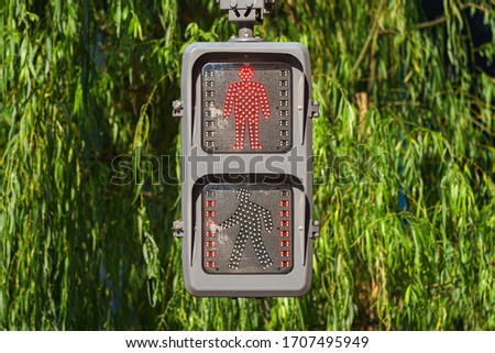 Pedestrian traffic light close up with red light on in Japan