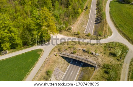 Aerial view of wildlife overpass over road in Switzerland Royalty-Free Stock Photo #1707498895