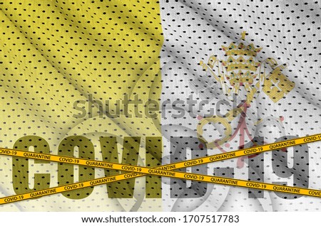 Vatican City State flag and Covid-19 inscription with orange quarantine border tape. Coronavirus or 2019-nCov virus concept