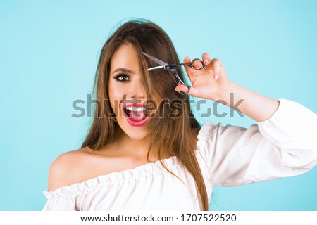 Haircut. Beautiful woman cut her hair. Women's haircut and hairdresser. Bangs hair. Close up hairstyle with bangs Royalty-Free Stock Photo #1707522520