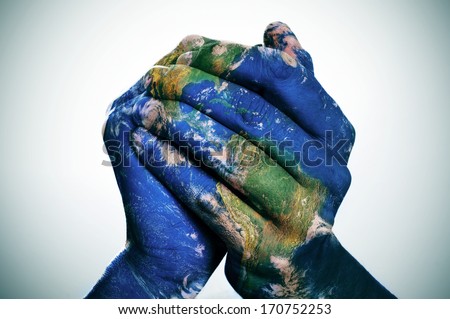 a world map in man hands forming a globe (Earth map furnished by NASA) Royalty-Free Stock Photo #170752253