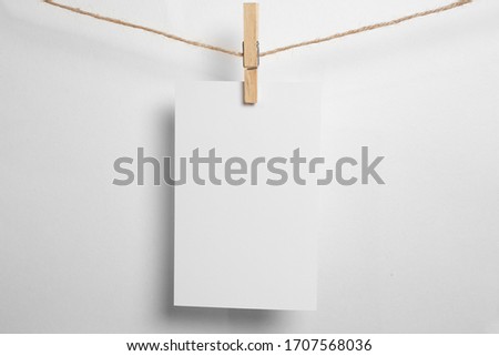 Retro photo frames hanging on rope isolated on white background. real photo.