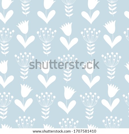 Seamless simple and flat floral ornament of small white silhouettes of tulips and berries on a branch on a gray background.