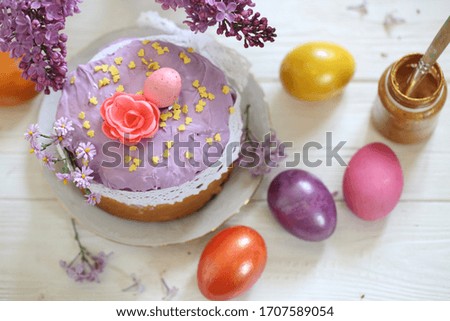 Easter still life with Easter cakes, lilac and paints
