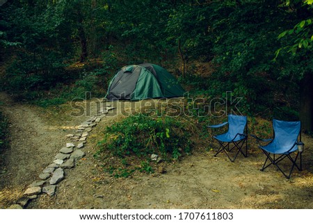 weekend relaxation camp site tent two chairs without people here in forest edge nature outside environment life style concept picture 