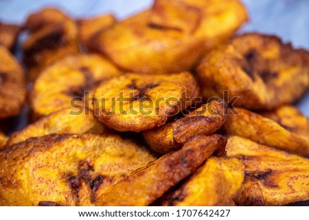 Ripe fried African plantain - local staple food served as meals with sauce or as a side dish in Nigeria, West Africa and other African countries. Deep Fried Nigerian Plantains ready to be served. Royalty-Free Stock Photo #1707642427