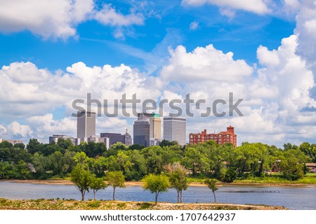 Tulsa, Oklahoma, USA downtown skyline on the Arkansas River in the afternoon.