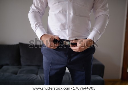 Businessman preparing for business. Suit and fashion