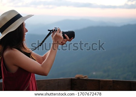 asian woman take photo. traveler tourist travel on holiday vacation. journey trip concept