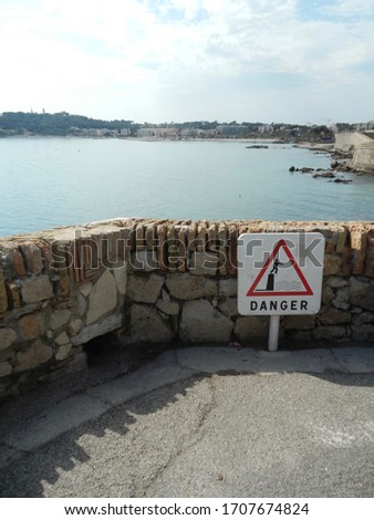Coastal view with danger sign