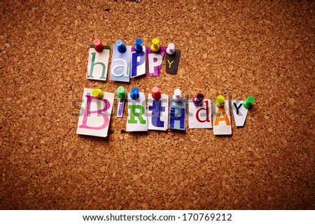  Happy Birthday - Cut out letters pinned on a notice board.