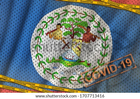 Belize flag and Covid-19 biohazard symbol with quarantine orange tape and stamp. Coronavirus or 2019-nCov virus concept