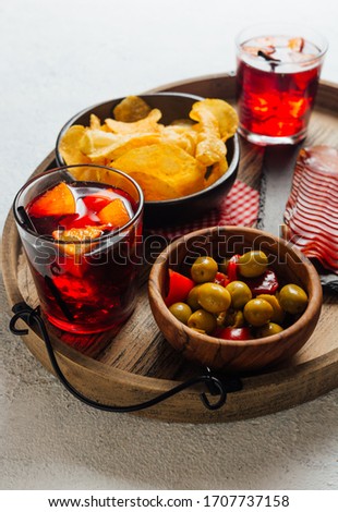 Pictures of typical Spanish food snacks (tapas). Composed of Sangria, iberian ham, manchego cheese and olives