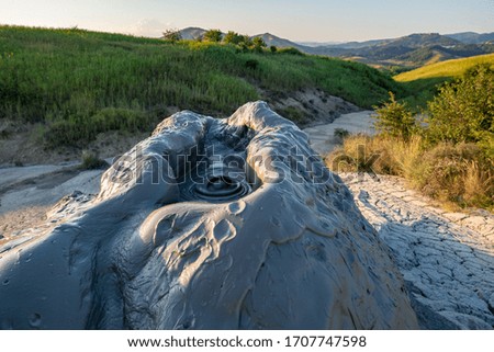 the mud volcano flows from the crater to the mud volcano

