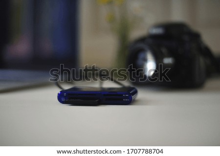 
Compact flash card reader and photo camera.