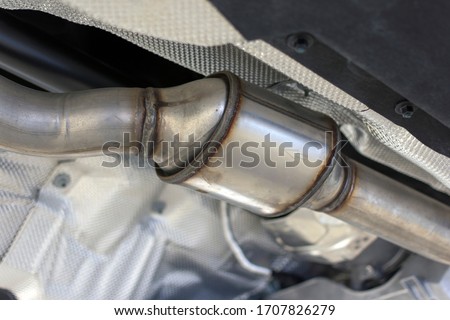 Catalytic converter of a modern car bottom view.	 Royalty-Free Stock Photo #1707826279