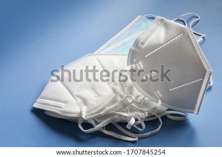 white KN95 or N95 mask with antiviral medical mask for protection against coronavirus. Surgical protective mask. prevention of the spread of virus and pandemic COVID-19. Royalty-Free Stock Photo #1707845254