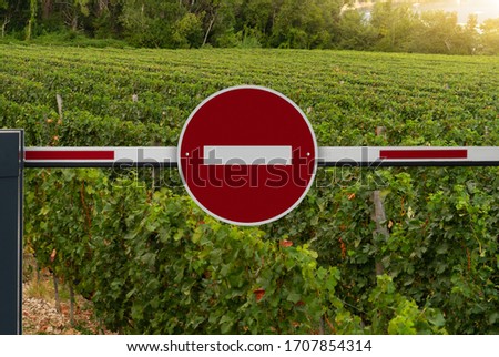 A barrier with a prohibition sign. A symbol of the crisis in the wine making industry