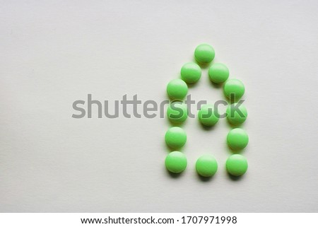 green tablet on white background