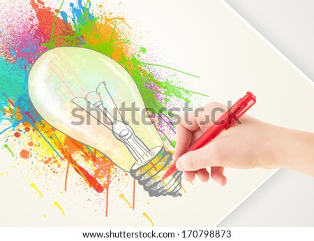 Hand drawing colorful idea light bulb with a pen on paper