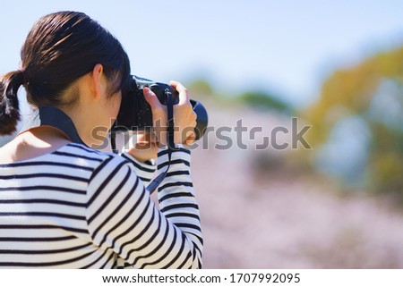 Japanese photographer woman shooting picture 