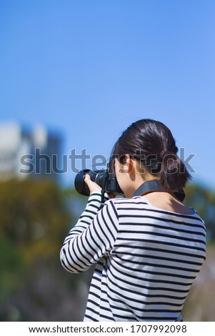 Japanese photographer woman shooting picture 