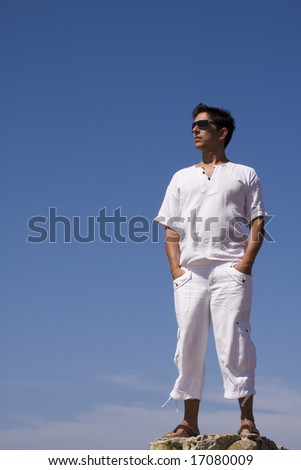young men dress in white with the blue sky as background