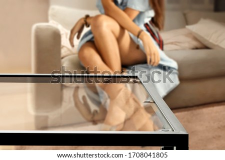 Table background of free space and woman body in home interior 