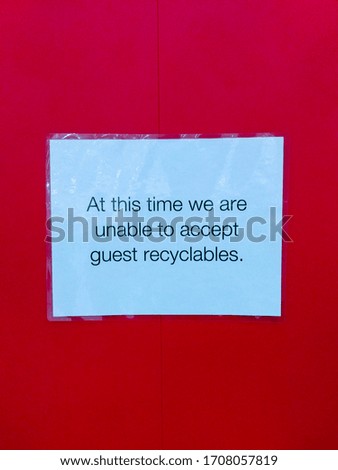 A notice hangs on a wall inside a department store. The information presented to shoppers is that recycling is no longer accepted. This is one month into the Covid-19 pandemic in the US.

April 2020