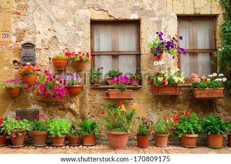 Beautiful street decorated with flowers in Italy Royalty-Free Stock Photo #170809175